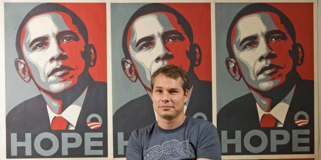 FILE - In this Jan. 12, 2009 file photo, Los Angeles street artist Shepard Fairey poses for a picture in front of Barack Oba