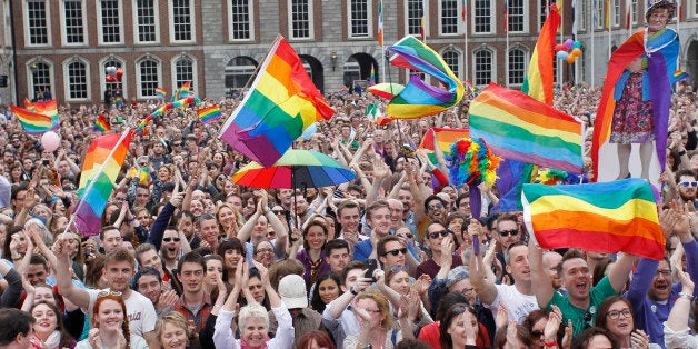 Yes supporters react at Dublin castle, Ireland, Saturday, May 23, 2015. Ireland has voted resoundingly to legalize gay marriage in the world's first national vote on the issue, leaders on both sides of the Irish referendum declared Saturday even as official ballot counting continued. Senior figures from the "no" campaign, who sought to prevent Ireland's constitution from being amended to permit same-sex marriages, say the only question is how large the "yes" side's margin of victory will be from Friday's vote. (AP Photo/Peter Morrison)