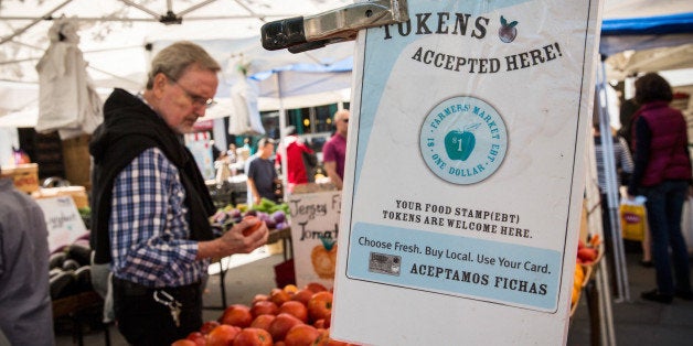 NEW YORK, NY - SEPTEMBER 18: A sign displays that a shop accepts Electronic Benefits Transfer (EBT), more commonly known as Food Stamps, in the GrowNYC Greenmarket in Union Square on September 18, 2013 in New York City. According to a Gallup poll released earlier this month, 20% of American adults struggled to buy enough food at some point in the last year. The rate of hungry people in America has gone relatively unchanged since 2008, suggesting the economic recovery since the 2008 recession may be disproportionately affecting the wealthy. More than 50 of GrowNYC's Greenmarket's now accept EBT; over $800,000 in sales were complete with EBT payment at the Greenmarket's in 2012. GrowNYC is also currently offering a program known as Health Bucks: for ever $5 spent using EBT at a Greenmarket, GrowNYC provides an additional $2, which can be spent specifically on fresh fruits and vegetables. (Photo by Andrew Burton/Getty Images)