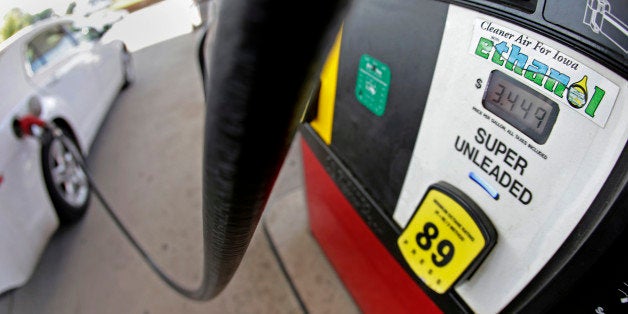 FILE This July 26, 2013 file photo shows a motorist filling up with gasoline containing ethanol in Des Moines. The Obama administration on Friday proposed to reduce the amount of ethanol in the nation's fuel supply for the first time, acknowledging that the biofuel law championed by both parties in 2007 is not working as well as expected.(AP Photo/Charlie Riedel, File)