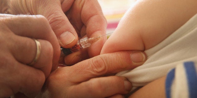 BERLIN, GERMANY - FEBRUARY 26: A children's doctor injects a vaccine against measles, rubella, mumps and chicken pox to an infant on February 26, 2015 in Berlin, Germany. The city of Berlin is facing an outbreak of measles that in recent weeks has led to over 700 cases and one confirmed death of a little boy who had not been vaccinated. Vaccination in Germany is not compulsory by law though the vast majority of parents have their children vaccinated. (Photo by Sean Gallup/Getty Images)