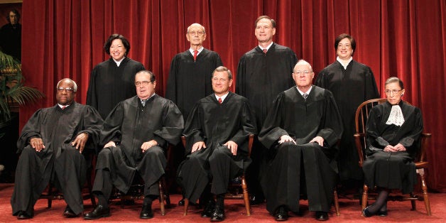 FILE -In this Oct. 8, 2010 file photo justices of the U.S. Supreme Court gather for a group portrait at the Supreme Court in Washington. Seated from left are Associate Justices Clarence Thomas, and Antonin Scalia, Chief Justice John Roberts, Associate Justices Anthony M. Kennedy, and Ruth Bader Ginsburg. Standing, from left are Associate Justices Sonia Sotomayor, Stephen Breyer, Samuel Alito Jr., and Elena Kagan. The nine justices of the Supreme Court, who serve without seeking election, soon will have to decide whether to insert themselves into the center of the nationâs presidential campaign next year. The high court begins its new term Monday, Oct. 3, 2011, and President Barack Obamaâs health care overhaul, which affects almost every American, is squarely in its sights. (AP Photo/Pablo Martinez Monsivais, File)