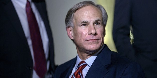 Texas Governor-Elect Greg Abbott (R-TX) listens to questions from the press after a meeting at the White House December 5, 2014 in Washington, DC. Obama met with the recently elected governors of Alaska, Illinois, Maryland, Massachusetts, Pennsylvania, Rhode Island and Texas. AFP PHOTO/Brendan SMIALOWSKI (Photo credit should read BRENDAN SMIALOWSKI/AFP/Getty Images)