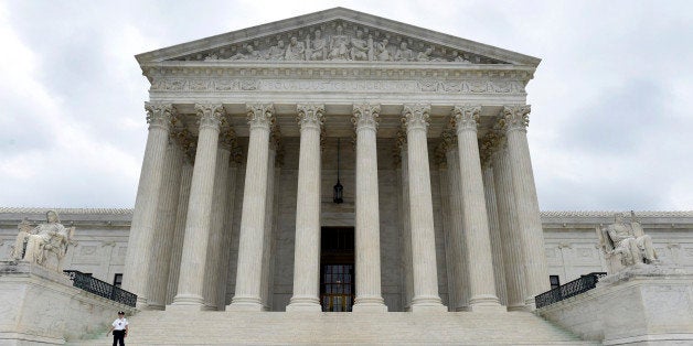 FILE - This Friday, Oct. 3, 2014 file photo, shows the U.S. Supreme Court in Washington. The Supreme Court is casting a skeptical eye on voter-approved commissions that draw a state's congressional district boundaries. The justices heard arguments Monday, March 2, 2015 in an appeal from Arizona Republicans who object to the state's independent redistricting commission that voters created to reduce political influence in the process. A decision against the commission also would threaten a similar system in neighboring California and could affect commissions in an additional 11 states. (AP Photo/Susan Walsh, File)