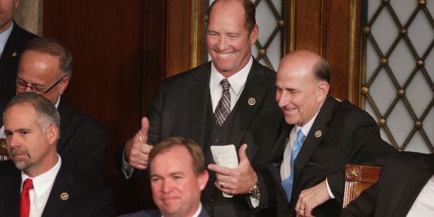 WASHINGTON, DC - JANUARY 06: Rep. Ted Yoho (R-FL) (C) gives a thumbs-up after voting for himself in the race for the Speaker of the House while standing next to Rep. Louie Gohmert (R-TX), who also ran for the Speaker inside the House of Representatives chamber at the U.S. Capitol January 6, 2015 in Washington, DC. Yoho and Gohmert both unsuccessfully challenged Speaker of the House John Boehner (R-OH) for the speakership. (Photo by Chip Somodevilla/Getty Images)