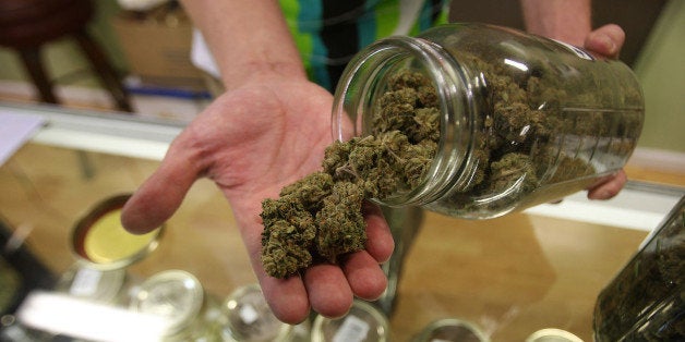 LOS ANGELES, CA - OCTOBER 19: Dave Warden, a bud tender at Private Organic Therapy (P.O.T.), a non-profit co-operative medical marijuana dispensary, displays various types of marijuana available to patients on October 19, 2009 in Los Angeles, California. Attorney General Eric Holder announced new guidelines today for federal prosecutors in states where the use of marijuana for medicinal purposes is allowed under state law. Federal prosecutors will no longer trump the state with raids on the southern California dispensaries as they had been doing, but Los Angeles County District Attorney Steve Cooley recently began a crackdown campaign that will include raids against the facilities. Cooley maintains that virtually all marijuana dispensaries are in violation of the law because they profit from their product. The city of LA has been slow to come to agreement on how to regulate its 800 to 1,000 dispensaries. Californians voted to allow sick people with referrals from doctors to consume cannabis with the passage of state ballot Proposition 215 in 1996 and a total of 14 states now allow the medicinal use of marijuana. (Photo by David McNew/Getty Images)