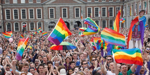 Yes supporters react at Dublin castle, Ireland, Saturday, May 23, 2015. Ireland has voted resoundingly to legalize gay marriage in the world's first national vote on the issue, leaders on both sides of the Irish referendum declared Saturday even as official ballot counting continued. Senior figures from the "no" campaign, who sought to prevent Ireland's constitution from being amended to permit same-sex marriages, say the only question is how large the "yes" side's margin of victory will be from Friday's vote. (AP Photo/Peter Morrison)