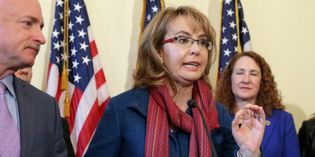 WASHINGTON, DC - MARCH 04: Former Congresswoman and handgun violence survivor Gabby Giffords speaks during a news conference with her husband Mark Kelly (L) and Rep. Elizabeth Esty (D-CT) about background checks for gun purchases at the Canon House Office Building on Capitol Hill March 4, 2015 in Washington, DC. The bipartisan King-Thompson Public Safety legislation is aimed at keeping guns from criminals & dangerously mentally ill by enforcing background checks for online and gun show purchases. (Photo by Chip Somodevilla/Getty Images)