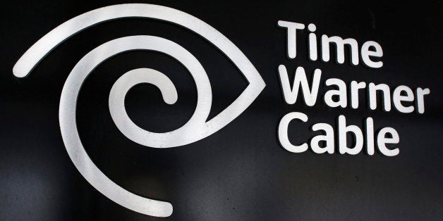 The Time Warner Cable corporate logo is displayed at a company store, Tuesday, May 26, 2015 in New York. Charter Communicatio