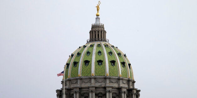 Shown is the Pennsylvania Capitol building on Tuesday, March 3, 2015, in Harrisburg, Pa. Gov. Tom Wolf is scheduled to deliver his budget address for the 2015-16 fiscal year to a joint session of the Pennsylvania House and Senate on Tuesday. (AP Photo/Matt Rourke)