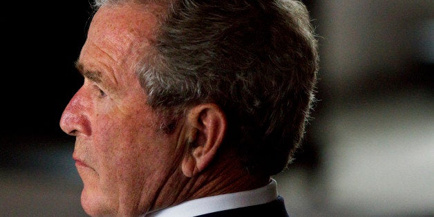 Former Presidents George W. Bush listen to an introduction at the Presidential Leadership Scholars Program Launch, Monday, Se