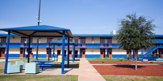 KARNES CITY, TX - JULY 31: The Karnes County Residential Center is viewed on July 31, 2014 in Karnes City, Texas. The civil facility is being used by U.S. Immigration and Customs Enforcement (ICE) to accomodate the increase of adults with children who have been apprehended illegally crossing the Southwest border. (Photo by Drew Anthony Smith/Getty Images)