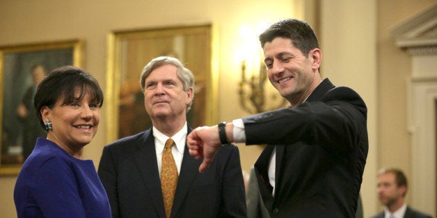 WASHINGTON, DC - APRIL 22: Committee chairman U.S. Rep. Paul Ryan (R-WI) (R) looks at his watch as Secretary of Commerce Penny Pritzker (L) and Secretary of Agriculture Tom Vilsack (2nd L) wait for the beginning of a hearing before House Ways and Means Committee April 22, 2015 on Capitol Hill in Washington, DC. The committee held the hearing on 'Expanding American Trade with Accountability and Transparency.' (Photo by Alex Wong/Getty Images)