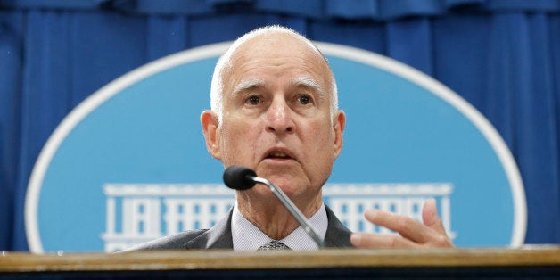 California Gov. Jerry Brown discusses his revised state budget plan during a news conference at the Capitol in Sacramento, Calif., Thursday May 14, 2015. Brown's $115.3 billion spending plan would send billions more to public schools and freeze in-state undergraduate tuition and establish a new state tax credit of the working poor. (AP Photo/Rich Pedroncelli)