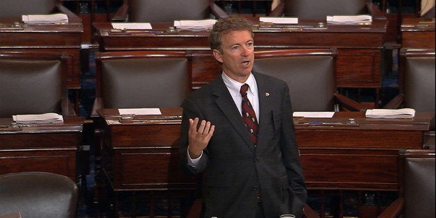 In this image from Senate video, Sen. Rand Paul, R-Ky., and a Republican presidential contender, speaks on the floor of the U.S. Senate Wednesday afternoon, May 20, 2015, at the Capitol in Washington, during a long speech opposing renewal of the Patriot Act. Paul claimed he was filibustering, but under the Senate rules, he wasn't. (Senate TV via AP)