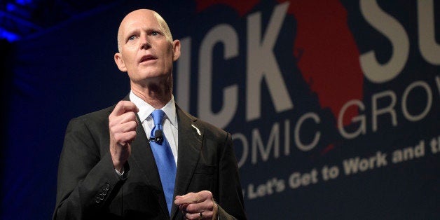 Florida Gov. Rick Scott gives the opening remarks during Rick Scott's Economic Growth Summit in Lake Buena Vista, Fla., Tuesday, June 2, 2015. (AP Photo/Phelan M. Ebenhack)