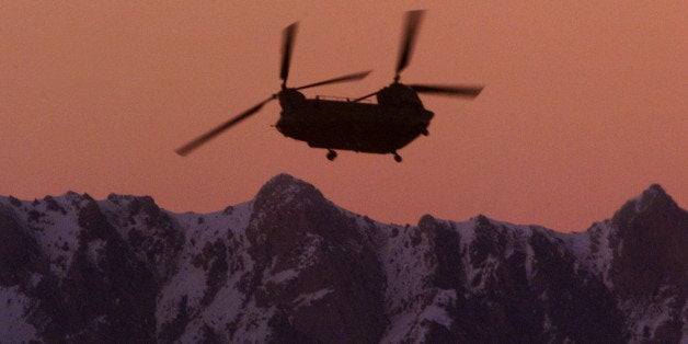 A U.S. CH-47 Chinook helicopter flies over the Paktia province town of Gardez, Afghanistan in this March 5, 2002 photo. The