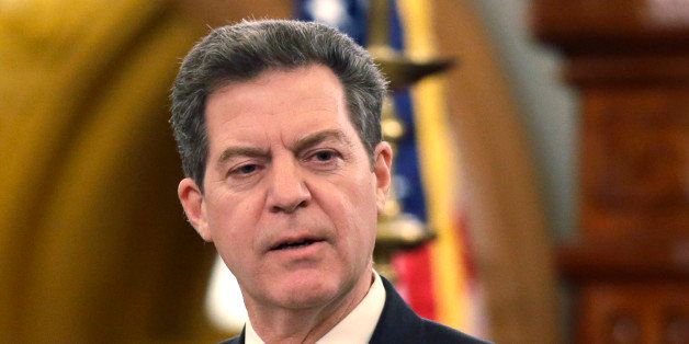 Gov. Sam Brownback delivers his State of the State address at the Kansas Statehouse in Topeka, Kan., Thursday, Jan. 15, 2015. (AP Photo/Orlin Wagner)