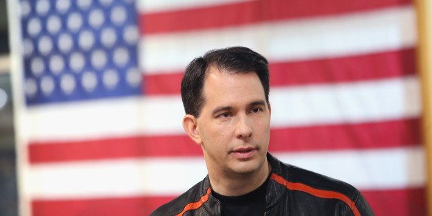 DES MOINES, IA - JUNE 06: Wisconsin Governor Scott Walker gets ready to participate in a Roast and Ride event hosted by freshman Sen. Joni Ernst (R-IA) on June 5, 2015 near Des Moines, Iowa. Ernst is hoping the event, which featured a motorcycle tour, a pig roast, and speeches from several 2016 presidential hopefuls, becomes an Iowa Republican tradition. (Photo by Scott Olson/Getty Images)