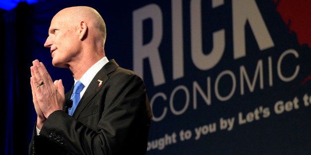 Florida Gov. Rick Scott gives the opening remarks during Rick Scott's Economic Growth Summit in Lake Buena Vista, Fla., Tuesday, June 2, 2015. (AP Photo/Phelan M. Ebenhack)