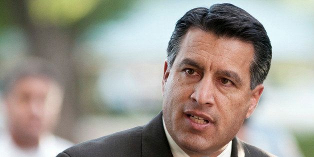 FILE - In this Sept. 25, 2011, file photo Nevada Gov. Brian Sandoval speaks during a memorial service in Reno, Nev. Nevada's Republican governor, Brian Sandoval, secured an unlikely victory, Monday, June 1, 2015, when the conservative state Legislature approved a huge tax increase at his urging as part of a plan to boost education spending. The $1.1 billion package raises taxes on businesses and cigarettes, and it makes permanent a $500 million bundle of temporary payroll and sales taxes. (AP Photo/Kevin Clifford, File)