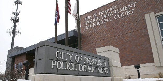 This photo taken Wednesday, March 4, 2015, shows the entrance to the Ferguson, Mo., Police Department. The Justice Department