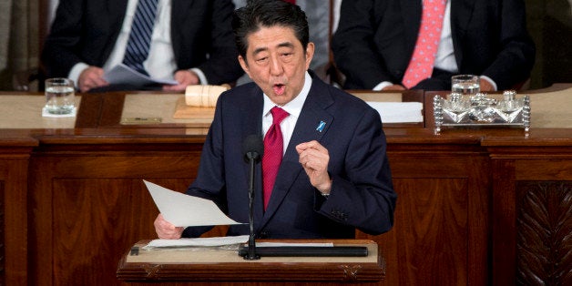 Japanese Prime Minister Shinzo Abe speaks before a joint meeting of Congress, Wednesday, April 29, 2015, on Capitol Hill in Washington. Vice President Joe Biden, left, and House Speaker John Boehner of Ohio listen. (AP Photo/Carolyn Kaster)