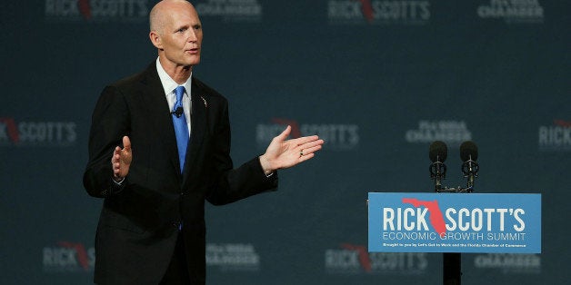 ORLANDO, FL - JUNE 02: Florida Governor Rick Scott makes an introductory statement before the start of the Rick ScottÃs Economic Growth Summit held at the Disney's Yacht and Beach Club Convention Center on June 2, 2015 in Orlando, Florida. Many of the leading Republican presidential candidates are scheduled to speak during the event. (Photo by Joe Raedle/Getty Images)