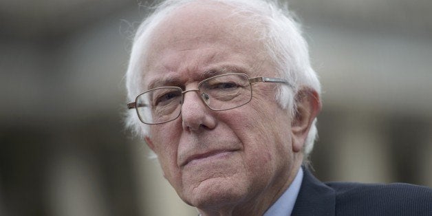 US presidential candidate Senator Bernie Sanders (I-VT) listens to speakers during an event on the Trans Pacific Partnership