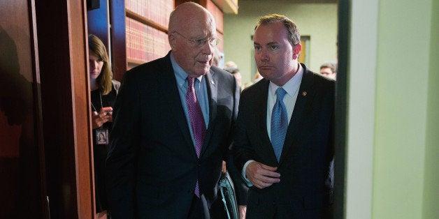 WASHINGTON, DC - JUNE 02: Sen. Mike Lee (R-UT) (R) and Sen. Patrick Leahy (D-VT) leave after holding a news conference about the passage of the USA FREEDOM Act at the U.S. Capitol June 2, 2015 in Washington, DC. Co-sponsored by Lee and Leahy, the legislation passed the Senate 67-32, matches the House version of the bill and will go to President Barack Obama for his signature. (Photo by Chip Somodevilla/Getty Images)