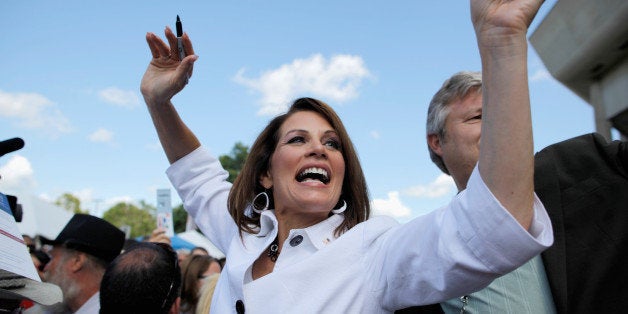 AMES, IA - AUGUST 13: Republican presidential candidate Rep. Michele Bachmann (R-MN) encourages people to vote for her outsi