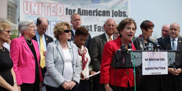 WASHINGTON, DC - JUNE 10: Rep. Jan Schakowsky (D-IL) (4th R) and fellow Democratic members of Congress hold a news conference with labor, envirnonmental and human rights leaders to voice their opposition to the Trans-Pacific Partnership trade deal at the U.S. Capitol June 10, 2015 in Washington, DC. The congressional Republican leadership announced that the House will vote Friday to approve the TPP and give President Barack Obama fast-track authority to negotiate a large-scale trade deal. (Photo by Chip Somodevilla/Getty Images)
