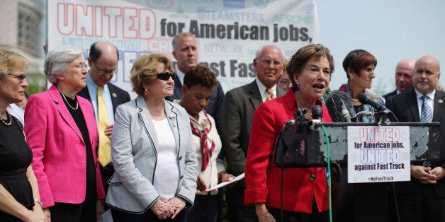 WASHINGTON, DC - JUNE 10: Rep. Jan Schakowsky (D-IL) (4th R) and fellow Democratic members of Congress hold a news conference with labor, envirnonmental and human rights leaders to voice their opposition to the Trans-Pacific Partnership trade deal at the U.S. Capitol June 10, 2015 in Washington, DC. The congressional Republican leadership announced that the House will vote Friday to approve the TPP and give President Barack Obama fast-track authority to negotiate a large-scale trade deal. (Photo by Chip Somodevilla/Getty Images)