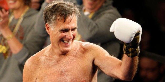 SALT LAKE CITY, UT - MAY 15: Mitt Romney gestures to the crowd during a fight against Evander Holyfield at a charity boxing event on May 15, 2015 in Salt Lake City, Utah. The event was held to raise money for 'Charity Vision' a charity that aims to restore sight to the blind and visually impaired. (Photo by George Frey/Getty Images)