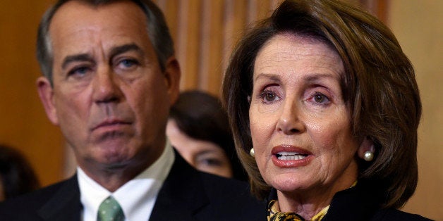 House Speaker John Boehner of Ohio listens at left as House Minority Leader Nancy Pelosi of Calif. speaks on Capitol Hill in Washington, Thursday, May 21, 2015, before Boehner signed the Justice for Victims of Trafficking Act during a ceremony. The legislation expands law enforcement tools to target sex traffickers and creates a new fund to help victims. (AP Photo/Susan Walsh)