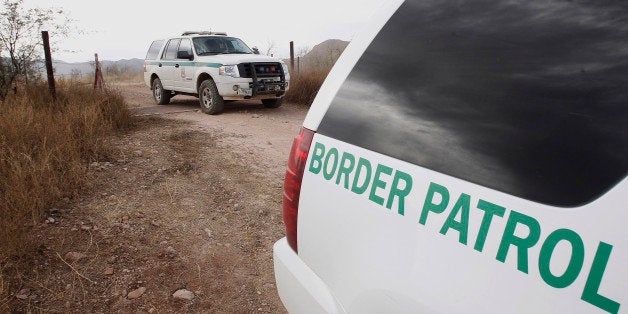 FILE - In this Thursday, Dec. 16, 2010 file photo, U.S. Border Patrol vehicles come and go from a checkpoint, as teams of bor