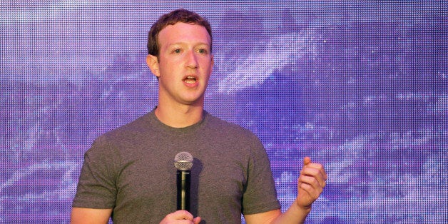 Facebook CEO Mark Zuckerberg delivers a speech during a workshop for application developers in Jakarta, Indonesia, Monday, Oct. 13, 2014. On his first visit to Facebook-crazy Indonesia, Zuckerberg met the president-elect, spread the word about his company's global Internet-access initiative and posted a photo of himself at an ancient Buddhist temple. (AP Photo/Achmad Ibrahim)