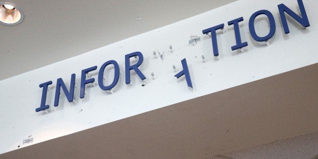 The information sign over the reception desk in the lobby at Dallas police headquarters shows gun shot damage Monday, June 15, 2015, in Dallas. James Boulware, the man authorities have linked to a weekend shooting outside police headquarters, showed signs of violence and mental instability for years beforehand, according to accounts from authorities and family members. (AP Photo/Tony Gutierrez)