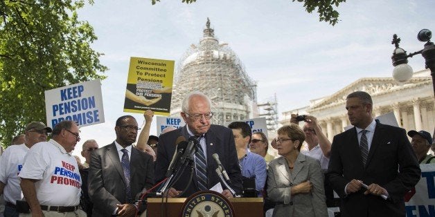 US Senate Budget Committee ranking member Senator Bernie Sanders (C), I-Vermont, speaks during a news conference to discuss legislation to restore pension guarantees for thousands of retired union workers, in front of the US Capitol in Washington, DC, June 18, 2015. AFP PHOTO/JIM WATSON (Photo credit should read JIM WATSON/AFP/Getty Images)