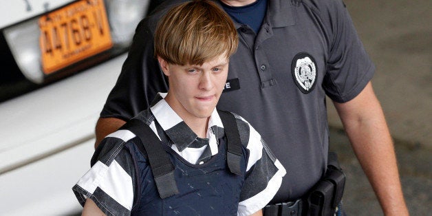 Charleston, S.C., shooting suspect Dylann Storm Roof is escorted from the Cleveland County Courthouse in Shelby, N.C., Thursday, June 18, 2015. Roof is a suspect in the shooting of several people Wednesday night at the historic The Emanuel African Methodist Episcopal Church in Charleston. (AP Photo/Chuck Burton)