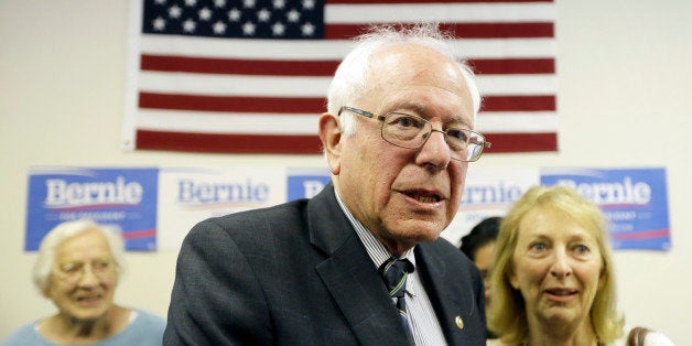 Democratic presidential candidate Sen. Bernie Sanders speaks with supporters during an open house at his Iowa campaign headqu