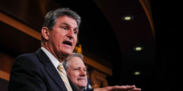 WASHINGTON, DC - JANUARY 6: Sen. Joe Manchin (D-WV) (L), and Sen. John Hoeven (R-ND) (R), speak to reporters at a news conference on the legislation to approve the Keystone XL pipeline project under the 'Commerce Clause of the U.S. Constitution, Article 1, Section 8' at the U.S. Capitol on January 6, 2015 in Washington, D.C. Manchin and Hoeven said that the legislation, which will authorize TransCanada to construct and operate the Keystone XL pipeline from Alberta, Canada to the U.S. Gulf Coast, will benefit the economy and give a much needed break to the American people. (Photo by Gabriella Demczuk/Getty Images)