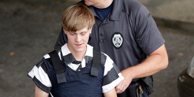 Charleston, S.C., shooting suspect Dylann Storm Roof is escorted from the Cleveland County Courthouse in Shelby, N.C., Thursd