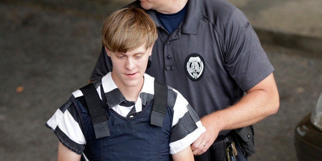 Charleston, S.C., shooting suspect Dylann Storm Roof is escorted from the Cleveland County Courthouse in Shelby, N.C., Thursday, June 18, 2015. Roof is a suspect in the shooting of several people Wednesday night at the historic The Emanuel African Methodist Episcopal Church in Charleston. (AP Photo/Chuck Burton)