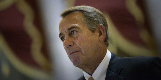 Speaker of the House John Boehner (R-OH) walks with others to a vote on Trade Promotion Authority on Capitol Hill June 12, 2015 in Washington, DC. The House of Representatives voted down a bill that will could effect the fast tracking of the Trans-Pacific Partnership trade agreement. AFP PHOTO/BRENDAN SMIALOWSKI (Photo credit should read BRENDAN SMIALOWSKI/AFP/Getty Images)
