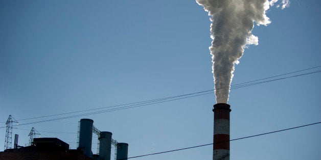 NEW EAGLE, PA - SEPTEMBER 24: A plume of exhaust extends from the Mitchell Power Station, a coal-fired power plant located 20 miles southwest of Pittsburgh, on September 24, 2013 in New Eagle, Pennsylvania. The plant, owned by FirstEnergy, will be one of two plants in the region to be shut down, affecting 380 employees. The Evironmental Protection Agency (EPA) and the Obama administration have been taking major steps to get coal-fired power plants into compliance with clean air regulations. (Photo by Jeff Swensen/Getty Images)