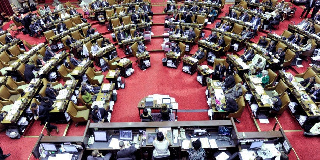 Members of the New York Assembly pass legislation in the Assembly Chamber at the Capitol on Thursday, June 18, 2015, in Albany, N.Y. (AP Photo/Hans Pennink)