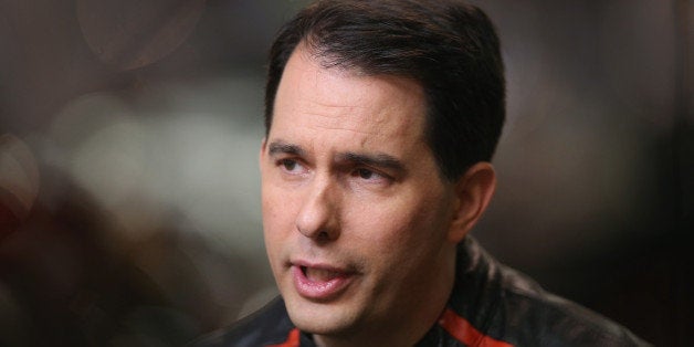 DES MOINES, IA - JUNE 06: Wisconsin Governor Scott Walker sits for an interview before participating in a Roast and Ride event hosted by freshman Senator Joni Ernst (R-IA) on June 6, 2015 near Des Moines, Iowa. Ernst is hoping the event, which featured a motorcycle tour, a pig roast, and speeches from several 2016 presidential hopefuls, becomes an Iowa Republican tradition. (Photo by Scott Olson/Getty Images)