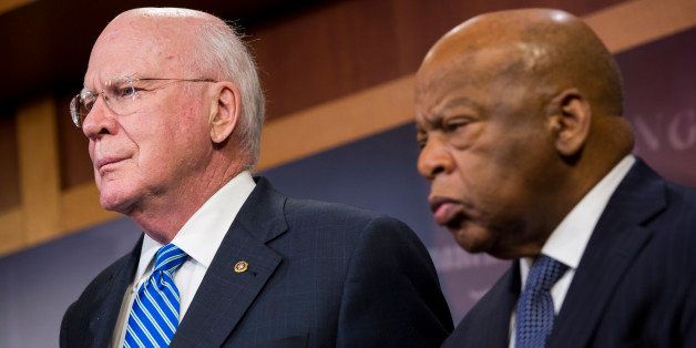 WASHINGTON, DC - JANUARY 16: U.S. Sen. Patrick Leahy (D-VT) (L) and Rep. John Lewis (D-GA) look on during a news conference on Capitol Hill, January 16, 2014 in Washington, DC. A group of lawmakers announced that they are introducing legislation, the Voting Rights Amendment Act of 2014, that would restore keys parts of the 1965 Voting Rights Act. (Photo by Drew Angerer/Getty Images)