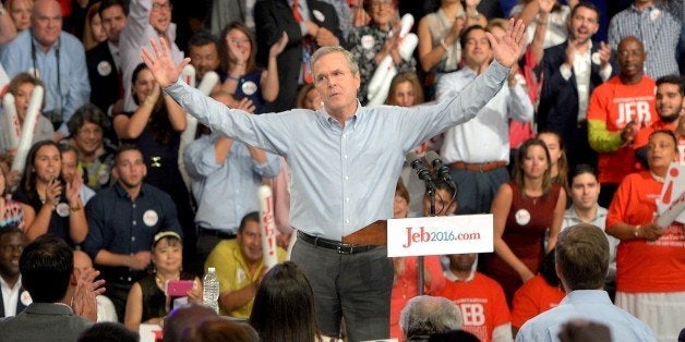 Former Republican Governor of Florida Jeb Bush (C) celebrates after announcing his candidacy for the 2016 Presidential elections, at Miami Dade College on June 15, 2015, in Miami, Florida. AFP PHOTO/ANDREW PATRON (Photo credit should read Andrew PATRON/AFP/Getty Images)